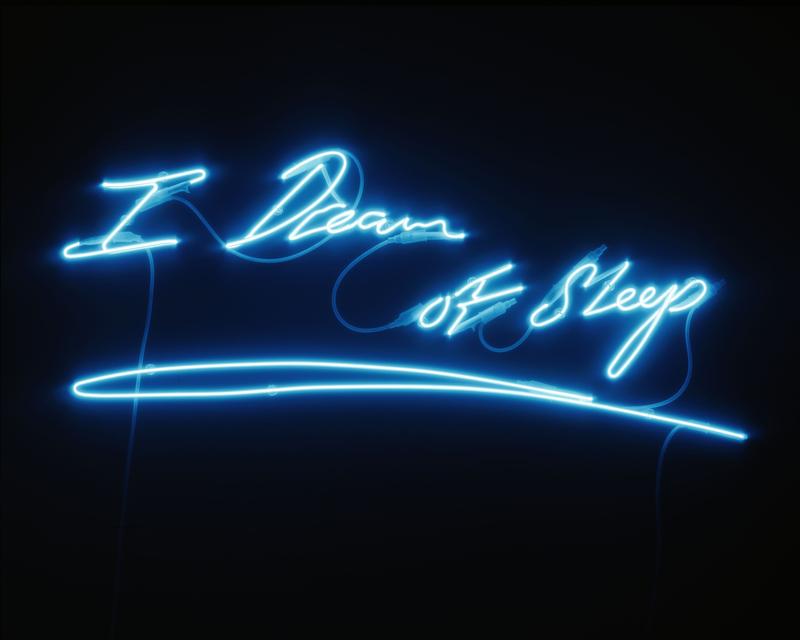 Neonschriftzug "I Dream of Sleep" in leuchtendem Blau auf schwarzem Hintergrund.