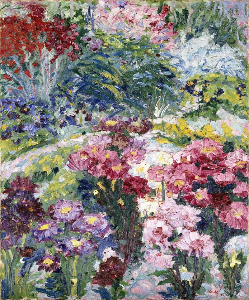 Das Bild zeigt einen bunten Blumengarten. Überall blühen rote, rosa, violette und gelbe Blumen. Man sieht sie in dichten Gruppen – nah beieinander, wie in einem wilden, lebendigen Garten.

Die Farben sind kräftig und leuchtend, mit vielen dicken Pinselstrichen. Die Blumen sind nicht ganz genau gemalt, sondern eher mit Gefühl und Bewegung. Man erkennt, dass es Nolde um die Stimmung ging – nicht um exakte Details.

Im Hintergrund sieht man noch mehr Blumen und grüne Blätter.